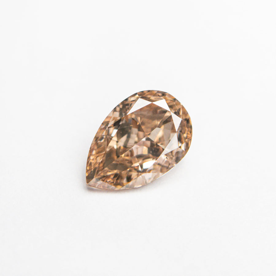 The 0.68ct 7.06x4.68x2.76mm VS2 Fancy Brownish Pink Pear Brilliant 🇦🇺 24112-01 by East London jeweller Rachel Boston | Discover our collections of unique and timeless engagement rings, wedding rings, and modern fine jewellery. - Rachel Boston Jewellery