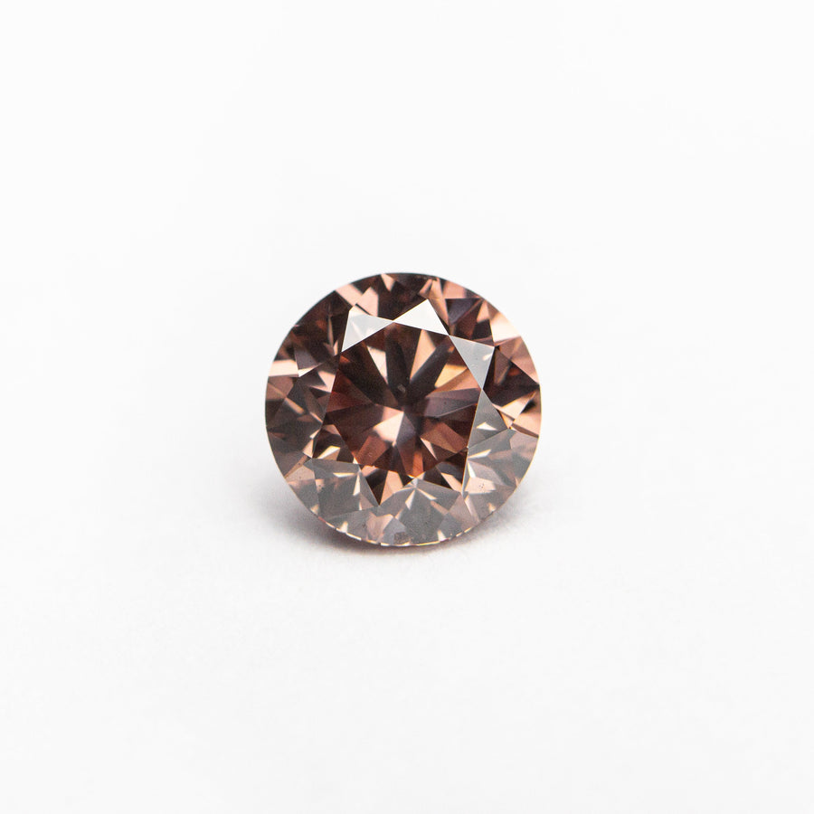 The 0.70ct 5.51x5.48x3.62 GIA SI1 Fancy Deep Orangy Pink Round Brilliant 🇦🇺 24147-01 by East London jeweller Rachel Boston | Discover our collections of unique and timeless engagement rings, wedding rings, and modern fine jewellery. - Rachel Boston Jewellery