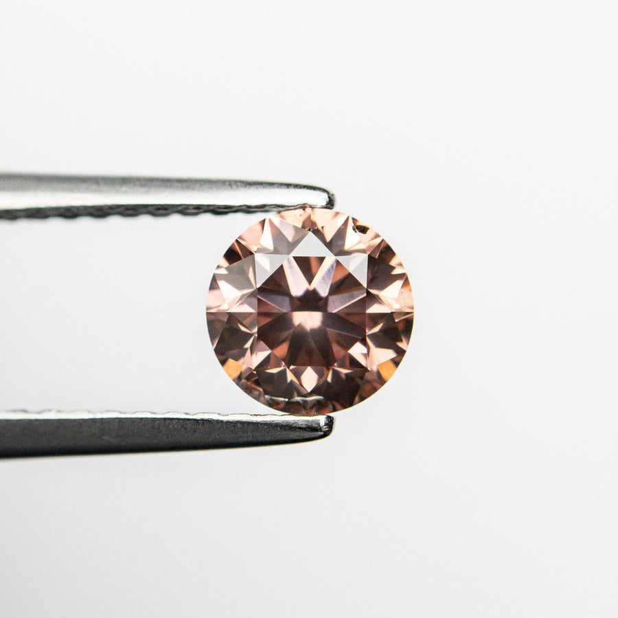 The 0.70ct 5.51x5.48x3.62 GIA SI1 Fancy Deep Orangy Pink Round Brilliant 🇦🇺 24147-01 by East London jeweller Rachel Boston | Discover our collections of unique and timeless engagement rings, wedding rings, and modern fine jewellery. - Rachel Boston Jewellery