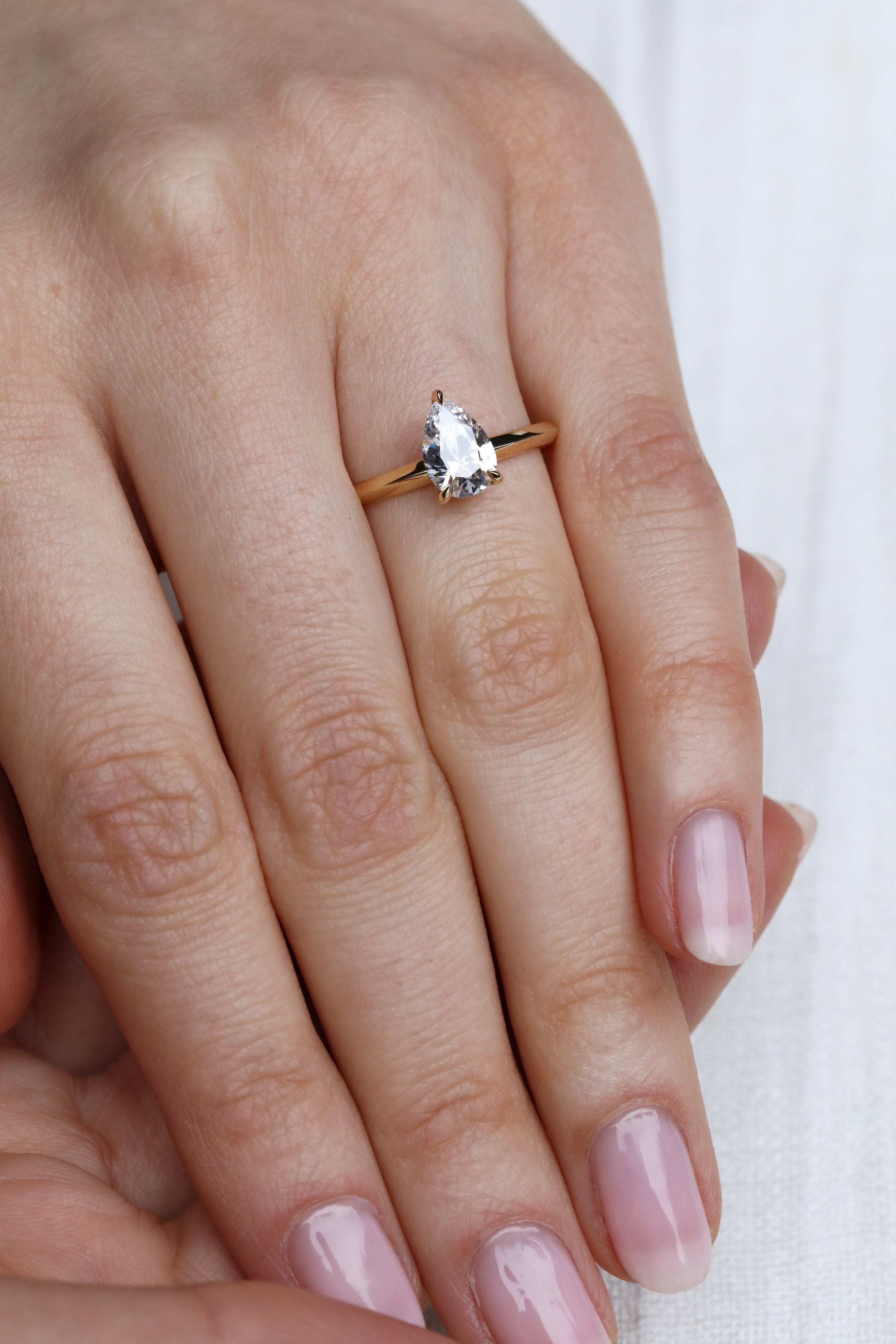 Solitaire pear cut sale engagement rings